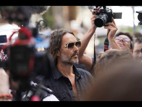 Actor--comedian Russell Brand arrives at Westminster Magistrates' court in London, Friday, May 2, 2025, to face charges of rape and sexual assault involving four women. (AP Photo/Alberto Pezzali)