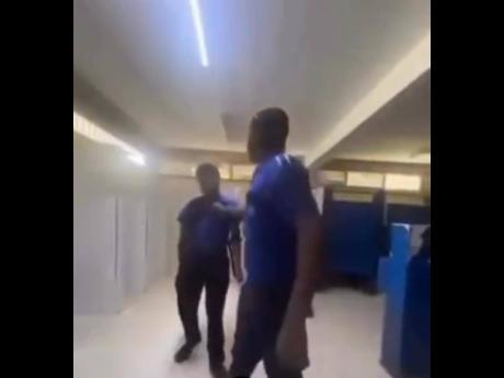 A screenshot from a video showing a Jamaica College student being assaulted by a schoolmate. 
