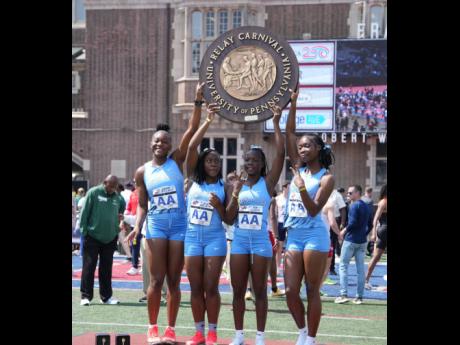 Members of the Edwin Allen High sprint relay team who won the Championship of America  4x100m title at the Penn Relays in Philadelphia on Saturday. From left: Alexxe Henry, Moesha Gayle, Reneica Edwards and Kelly Ann Carr. 