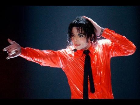 FILE – Michael Jackson performs during the taping of the American Bandstand’s 50th anniversary show in Pasadena, California in 2002. 