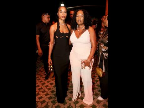 Roneika Melhado (left) and Juju Romillon share lens space at ONErpm celebration, held on Saturday at The Courtyard, Louise Bennett Garden Theatre, Hope Road, St Andrew.