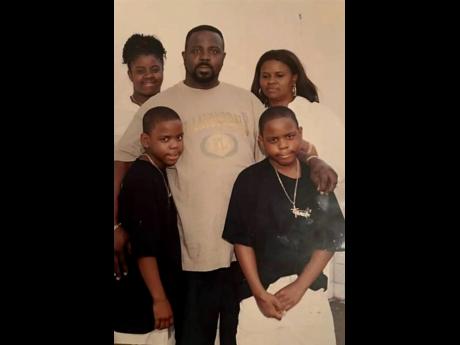 Big Stone with wife Darma and their three children, a loving family moment now held close in memory.