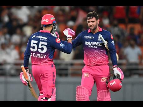 Rajasthan Royals’ Donovan Ferreira (right) and Shubham Dubey celebrate after they won the Indian Premier League match against Punjab Kings in New Chandigarh, India, yesterday.