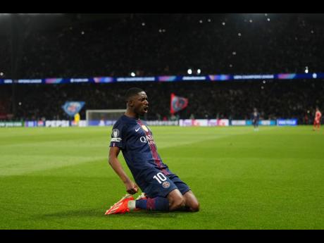 PSG’s Ousmane Dembele celebrates after scoring his side’s third goal during a Champions League semi-final, first leg match between Paris Saint-Germain and Bayern Munich in Paris, yesterday.