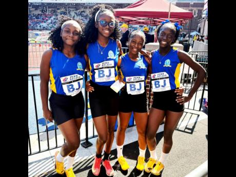 From left: Members of Penwood High School’s girls 4x100m relay team Rebecca Nugent, Shakeya Reid, Shaera Thorpe and Natalia Moore at the Penn Relays inside Franklin Field Stadium, Philadelphia, on Saturday.