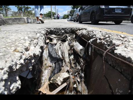 Section of the sidewalk along Marescaux Road in Kingston that has collapsed and poses a risk to pedestrians, especially the visually impaired.