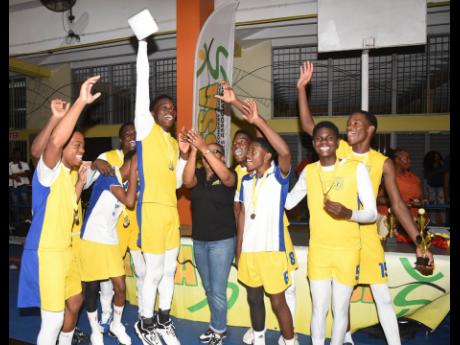Members of Papine High School celebrate after defeating Oracabessa High in the final of the ISSA all-island volleyball final at G.C. Foster College of Physical Education and Sport on Wednesday.