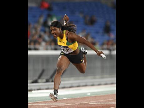 File photo shows Jonielle Smith driving through the finish line in the women’s 4x100 metre at the IAAF World Relays held in Yokohama, Japan in May, 2019.