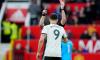 Fulham’s Aleksandar Mitrovic is shown red card during the English FA Cup quarter-final football match against Manchester United at the Old Trafford stadium in Manchester, England, on Sunday.