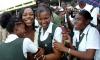 File photo shows legendary Jamaican sprinter Veronica Campbell-Brown (second left) greeting students at her alma mater, Vere Technical High School’s homecoming tour for the Olympians at the school in Clarendon. Campbell-Brown has been supporting the educational efforts of girls at the institution through her VCB Foundation.