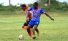 Akeil Leachman of Tivoli Gardens FC (left) battles for the ball with Akeem Mullings of Portmore United FC during the Jamaica Premier League football match at Edward Seaga Sports Complex in Kingston. The game ended 2-2.