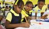 Students of Green Island Primary School participate in solving equations during the 2026 Mathematics Problem-Solving Competition finale, held on March 12 at Merl Grove High School in Kingston.

